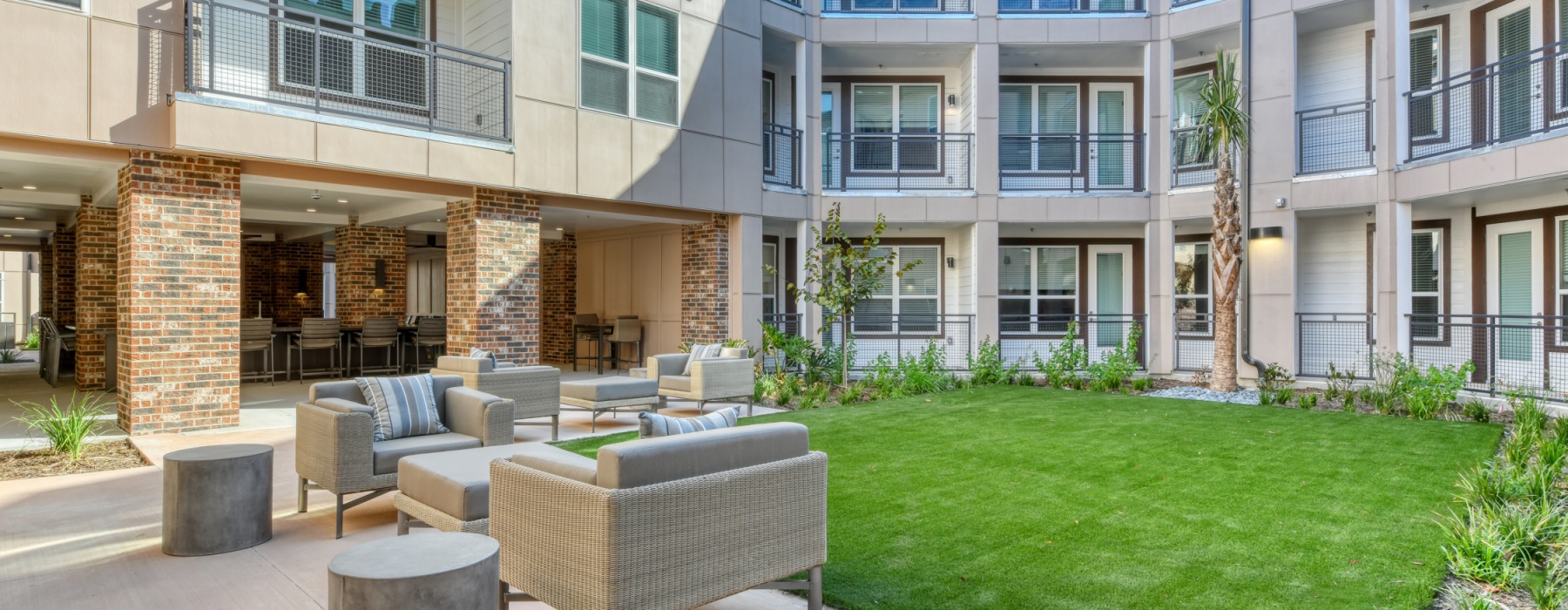 Grassy courtyard with seating at Citadel Urban's luxury apartments in San Antonio, TX