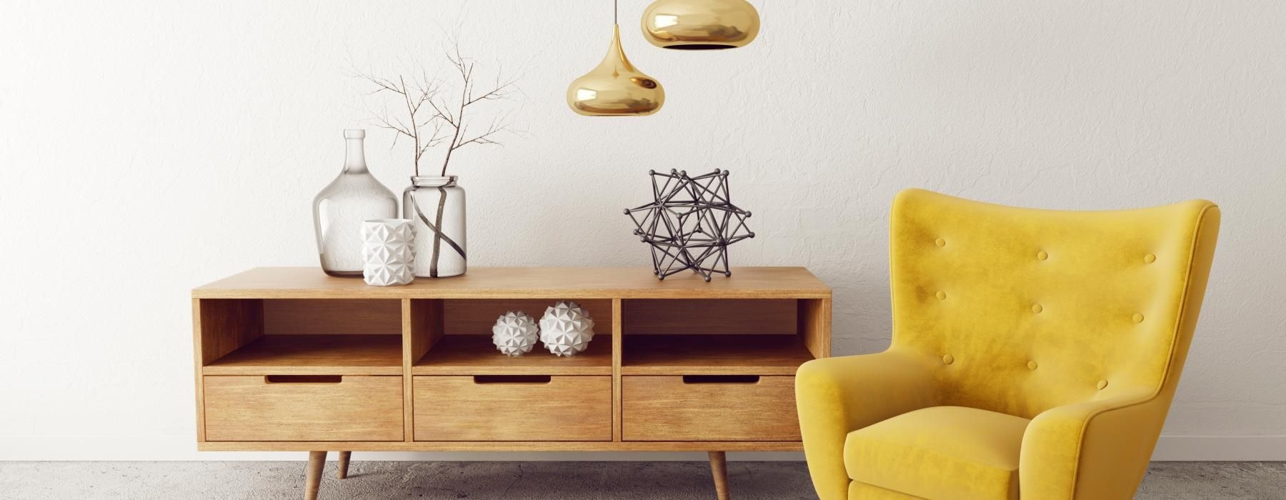 a yellow chair next to a desk